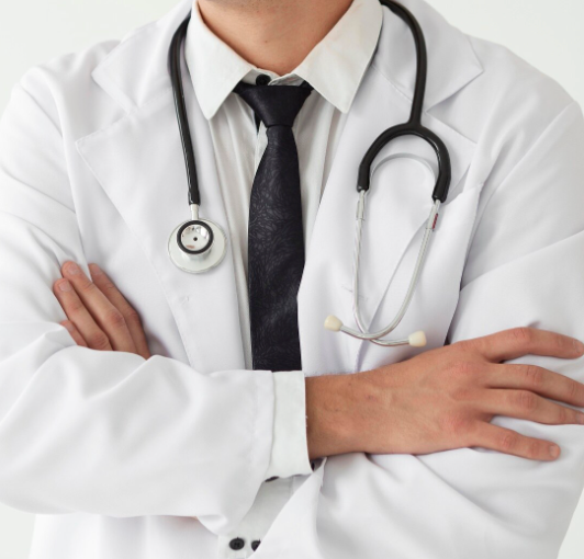 Doctor writing notes on a clipboard