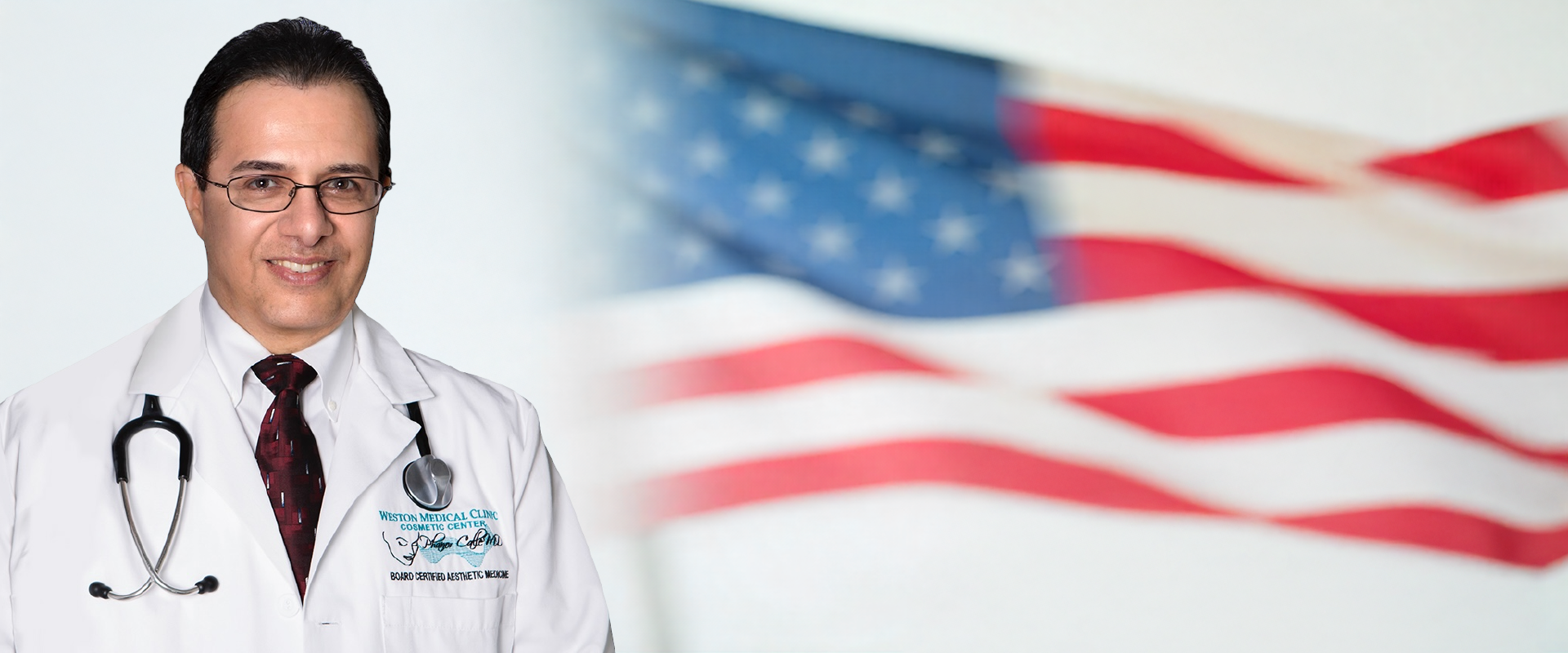 Dr. Phanor Calle, FAA Medical Examiner in Weston, Florida, standing in front of the American flag